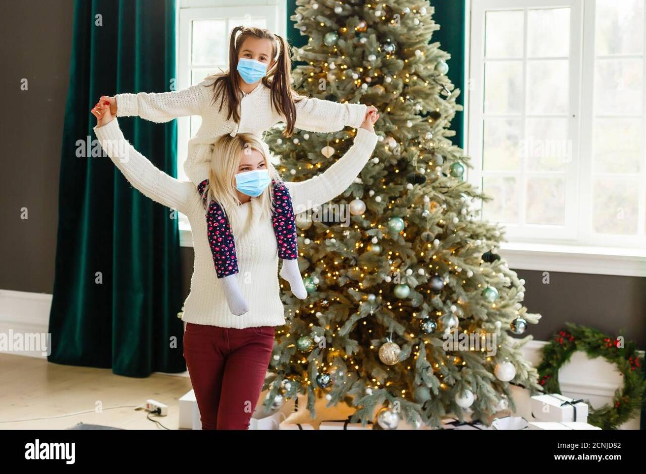 Family in protective masks quarantined. Normal life with coronavirus ...